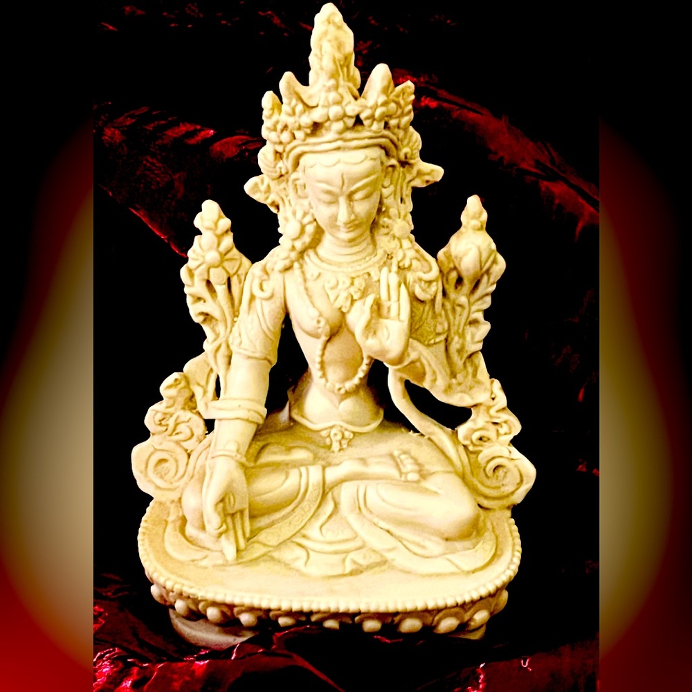 White Tara protective deity hand raised palm facing out fear dispelling mudra.